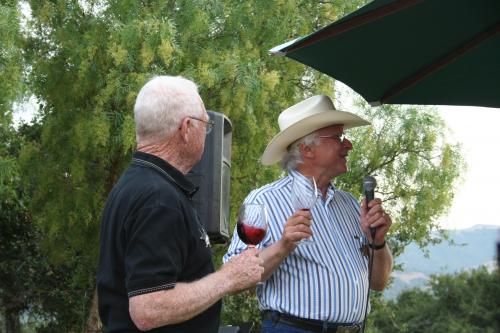 Royce Lewellen and Louis Lucas speak at wine club summer bbq
